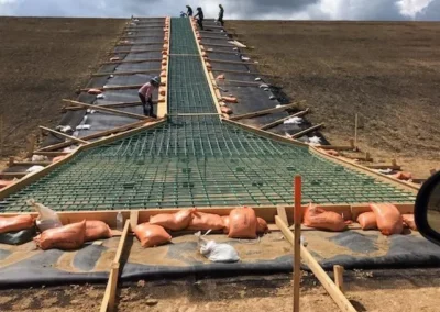 Construction of Splash Pads for Brine Ponds: Civil and Dirt Work
